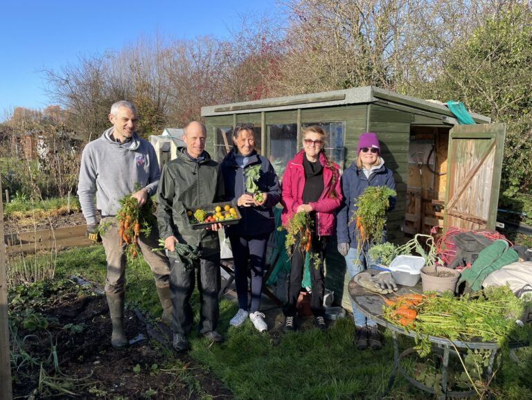 community growing group in front of shed